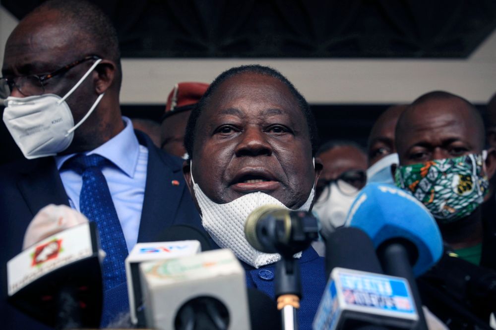 Former president Henri Konan Bedie, of the PDCI-RDA party, speaks to the media after presenting his candidacy at the election commission in Abidjan, Ivory Coast Thursday, Aug. 27, 2020. Two main opposition leaders in Ivory Coast who pose the strongest threat to incumbent President Alassane Ouattara are filing to become official candidates for their parties for October elections. (AP Photo/Diomande Ble Blonde)